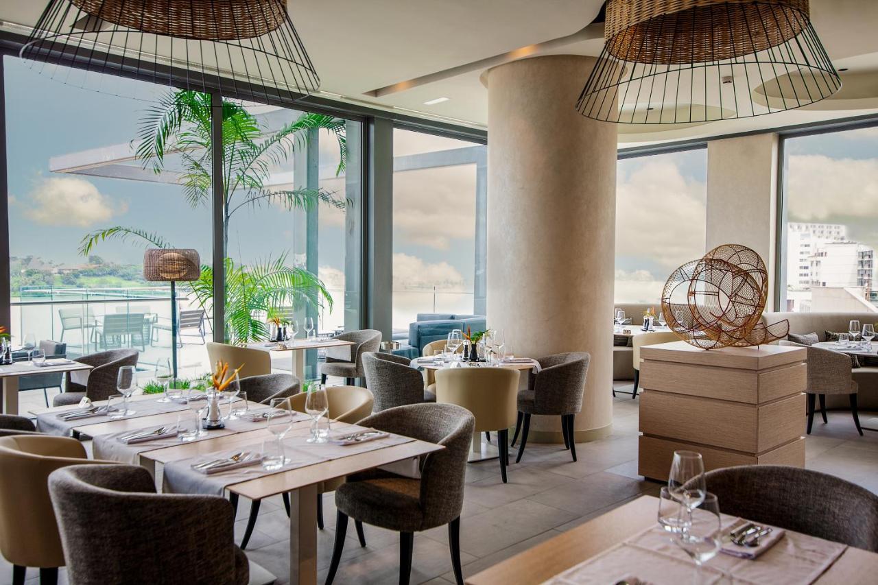 Noom Hotel Abidjan Plateau Exterior photo The restaurant